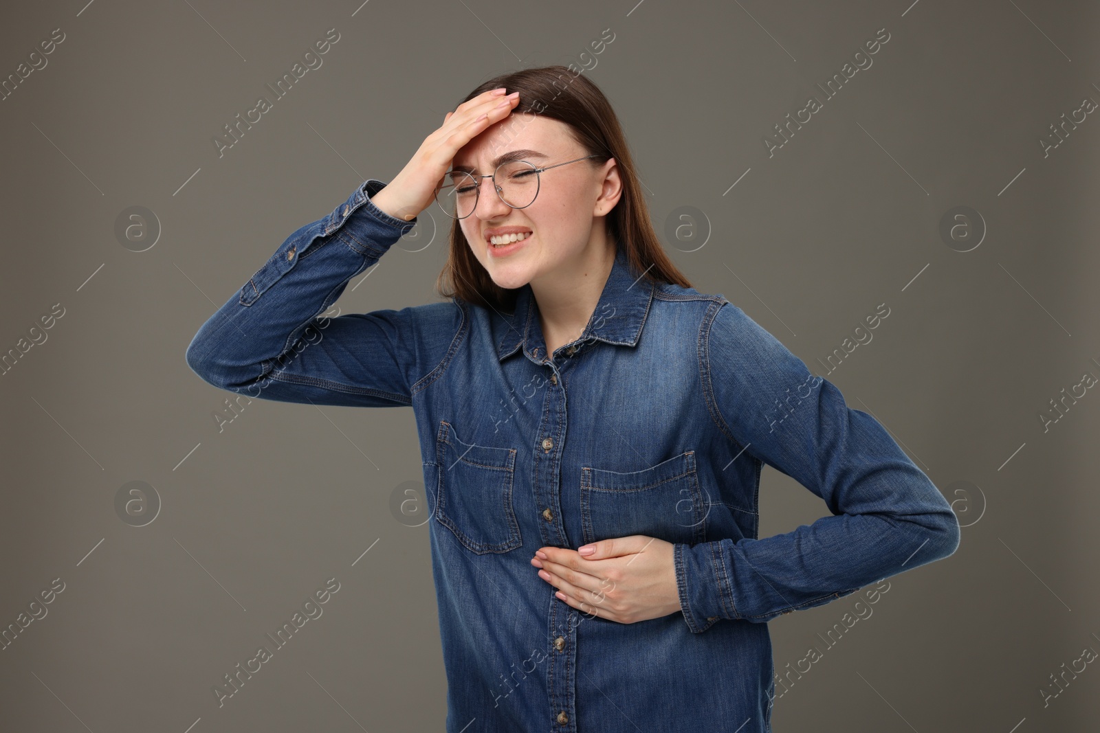 Photo of Woman having heart attack on grey background