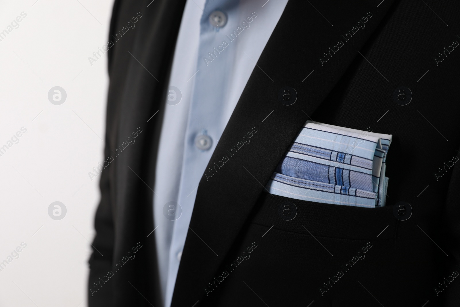 Photo of Man with handkerchief in suit pocket on white background, closeup