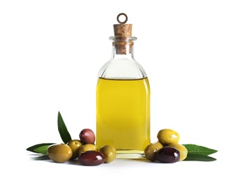 Glass bottle with fresh olive oil on white background