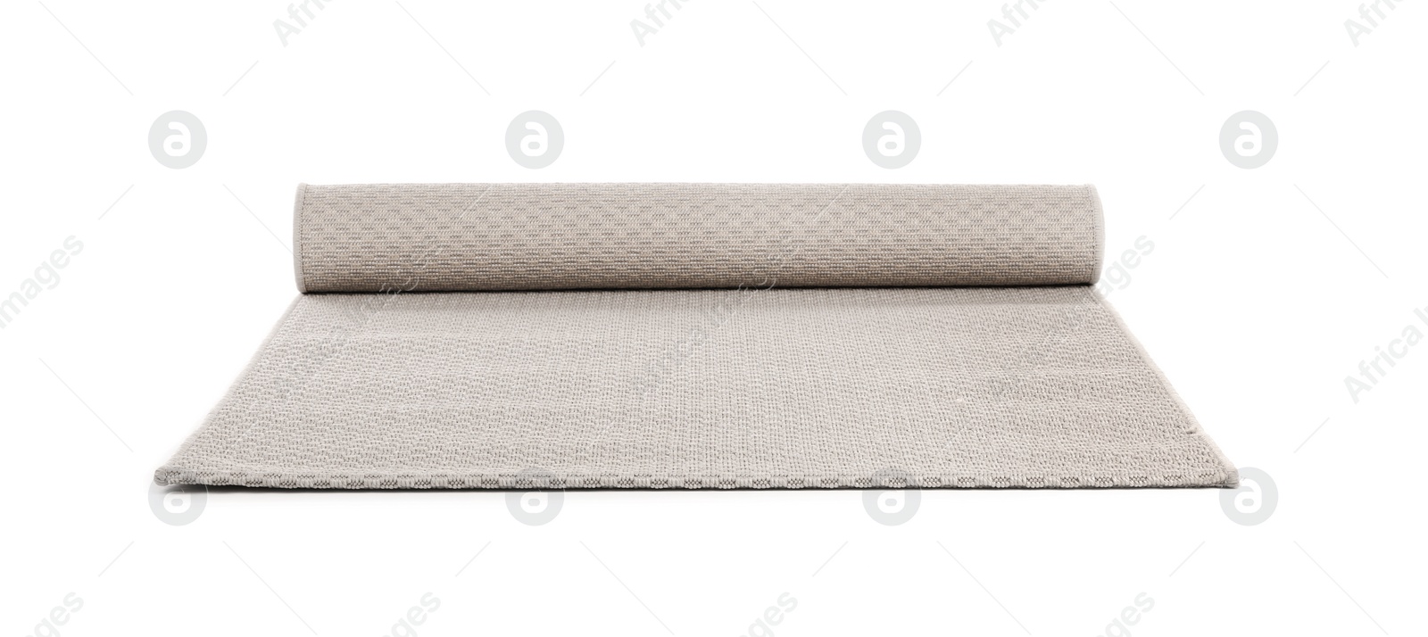 Photo of Rolled grey carpet on white background. Interior element