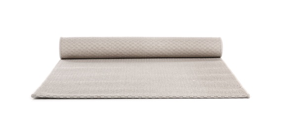 Rolled grey carpet on white background. Interior element