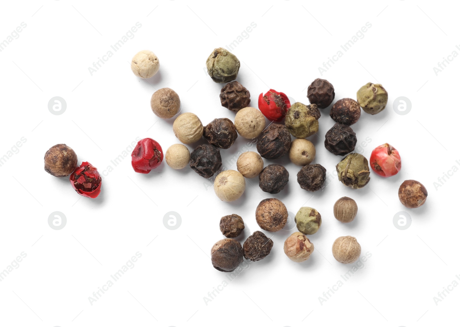 Photo of Aromatic spices. Pile of different peppers isolated on white, top view