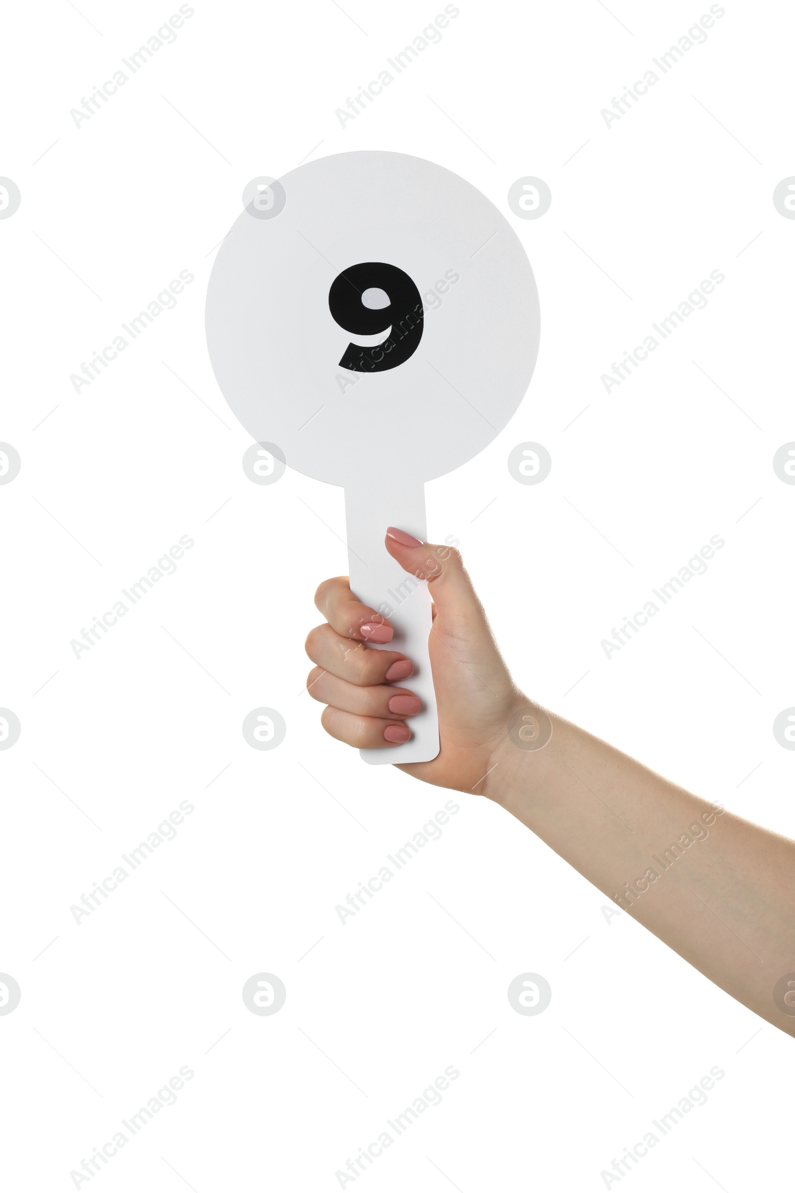 Photo of Woman holding auction paddle with number 9 on white background, closeup