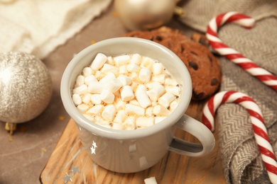 Photo of Composition with cup of hot winter drink on table. Cozy season