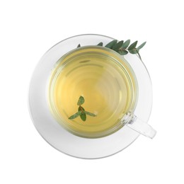 Photo of Cup of green tea with eucalyptus leaves on white background, top view