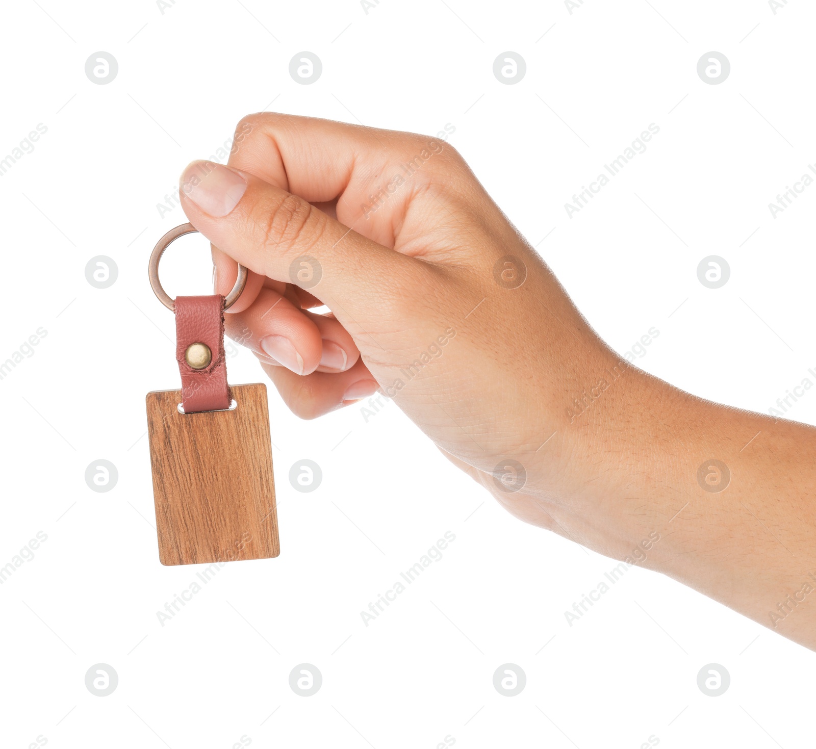 Photo of Woman holding wooden keychain on white background, closeup