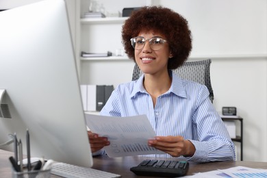 Professional accountant working on computer in office