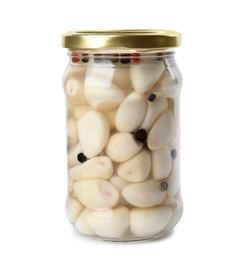 Photo of Jar with pickled garlic on white background