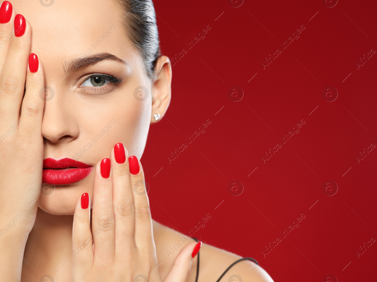 Photo of Beautiful young woman with bright manicure on color background, space for text. Nail polish trends