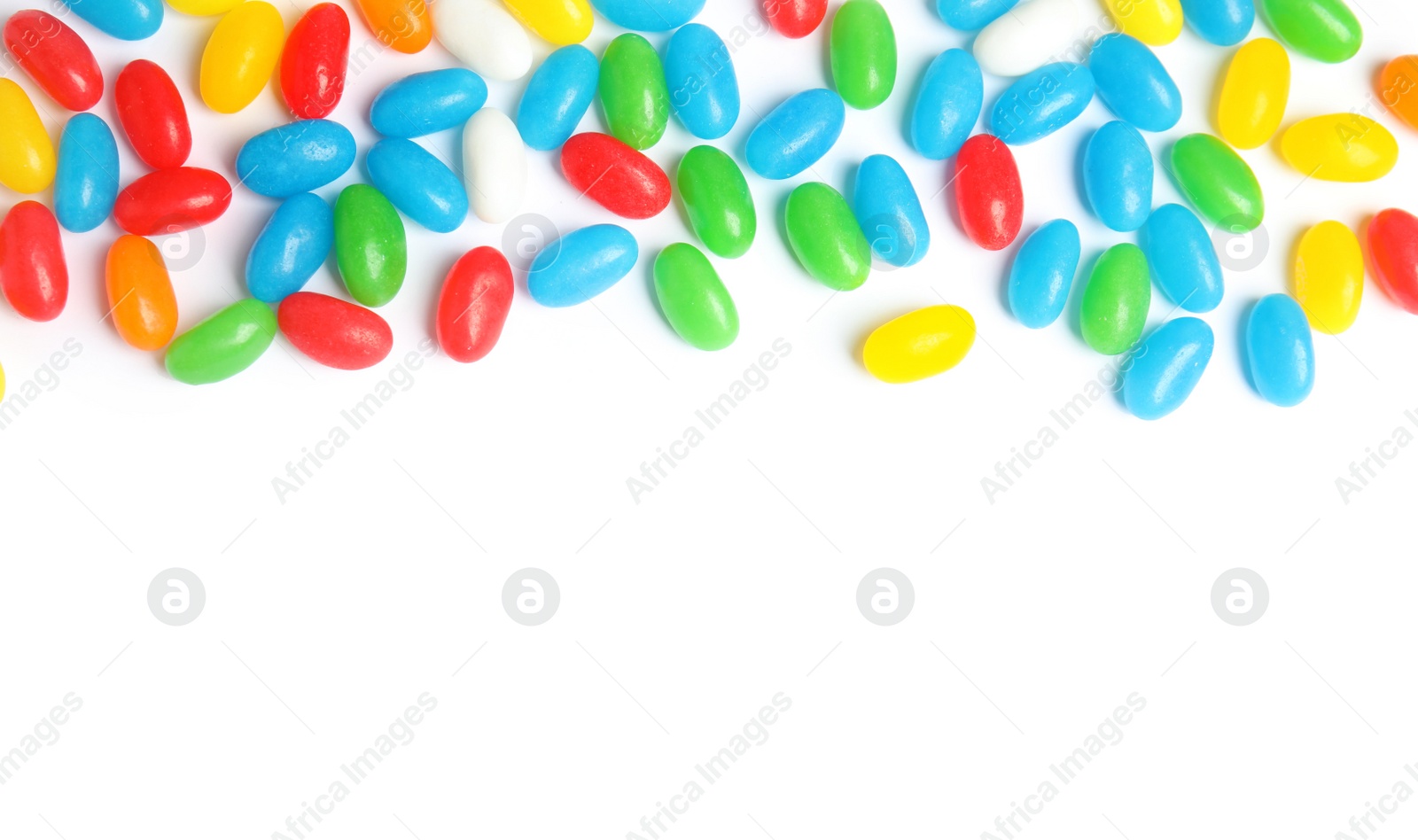 Photo of Colorful jelly beans on white background, top view