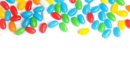 Photo of Colorful jelly beans on white background, top view