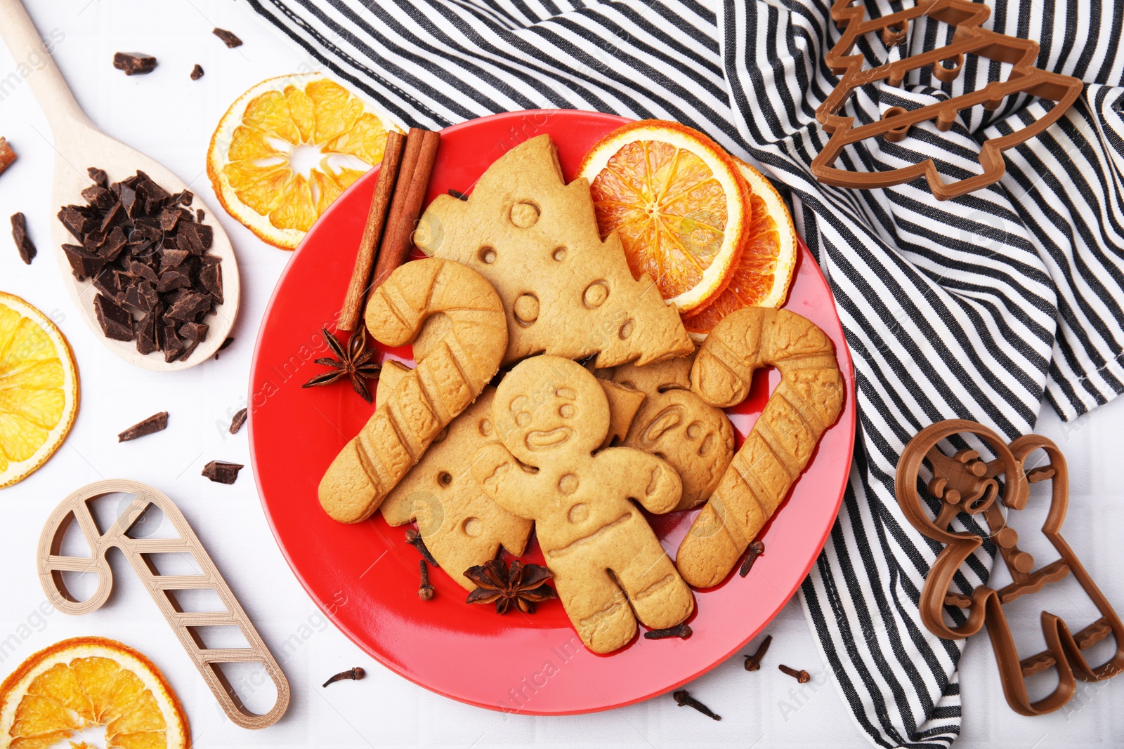 Photo of Flat lay composition with tasty cookies and cutters on white table