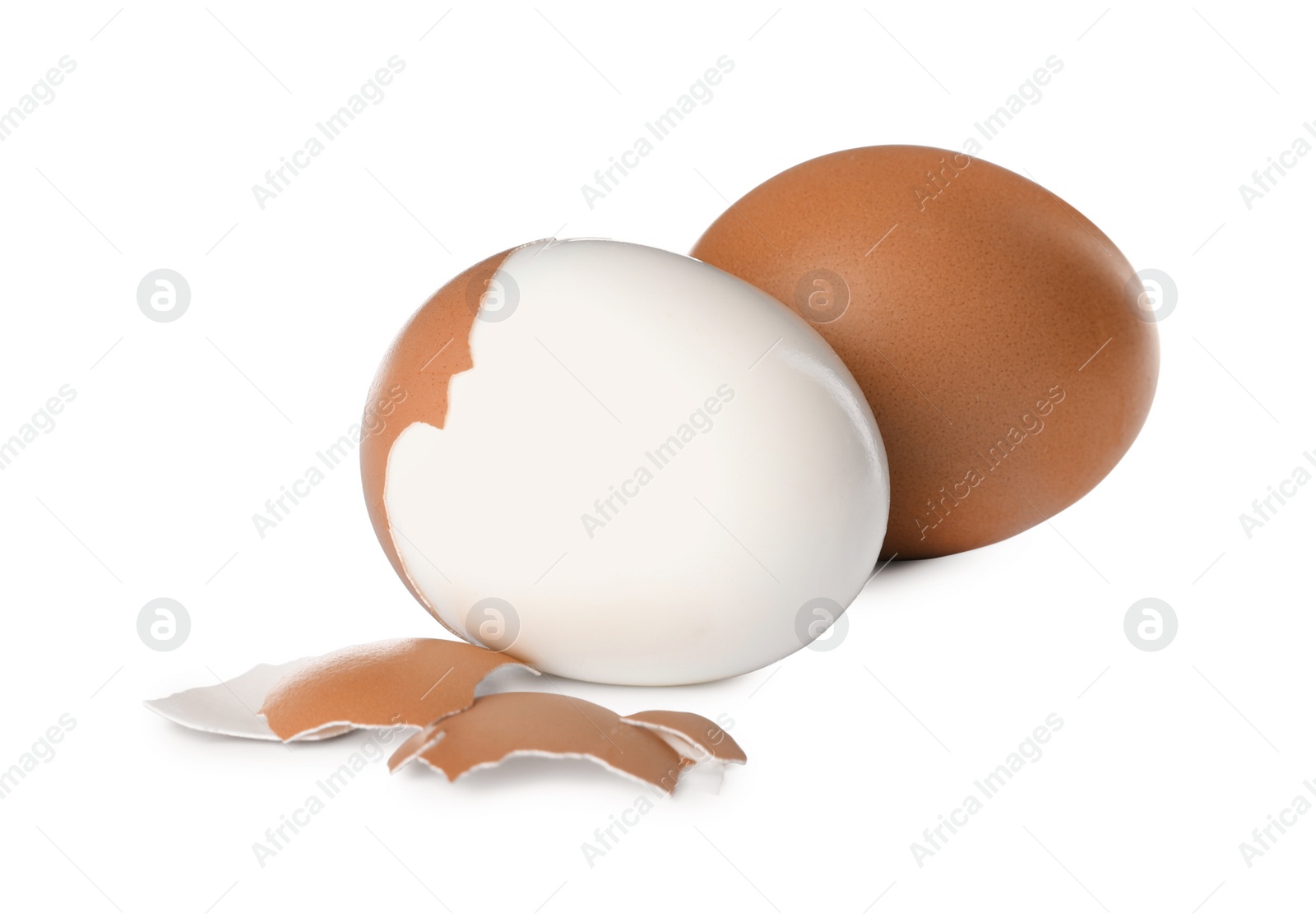 Photo of Fresh boiled eggs and shell on white background