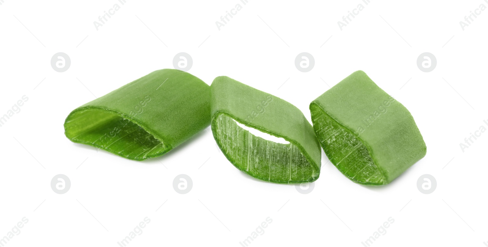 Photo of Pieces of fresh green onion isolated on white