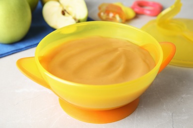 Bowl of healthy baby food on light table