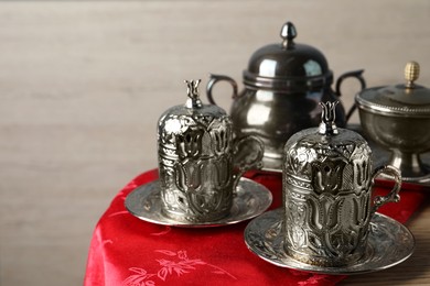 Photo of Vintage tea set on wooden table. Space for text