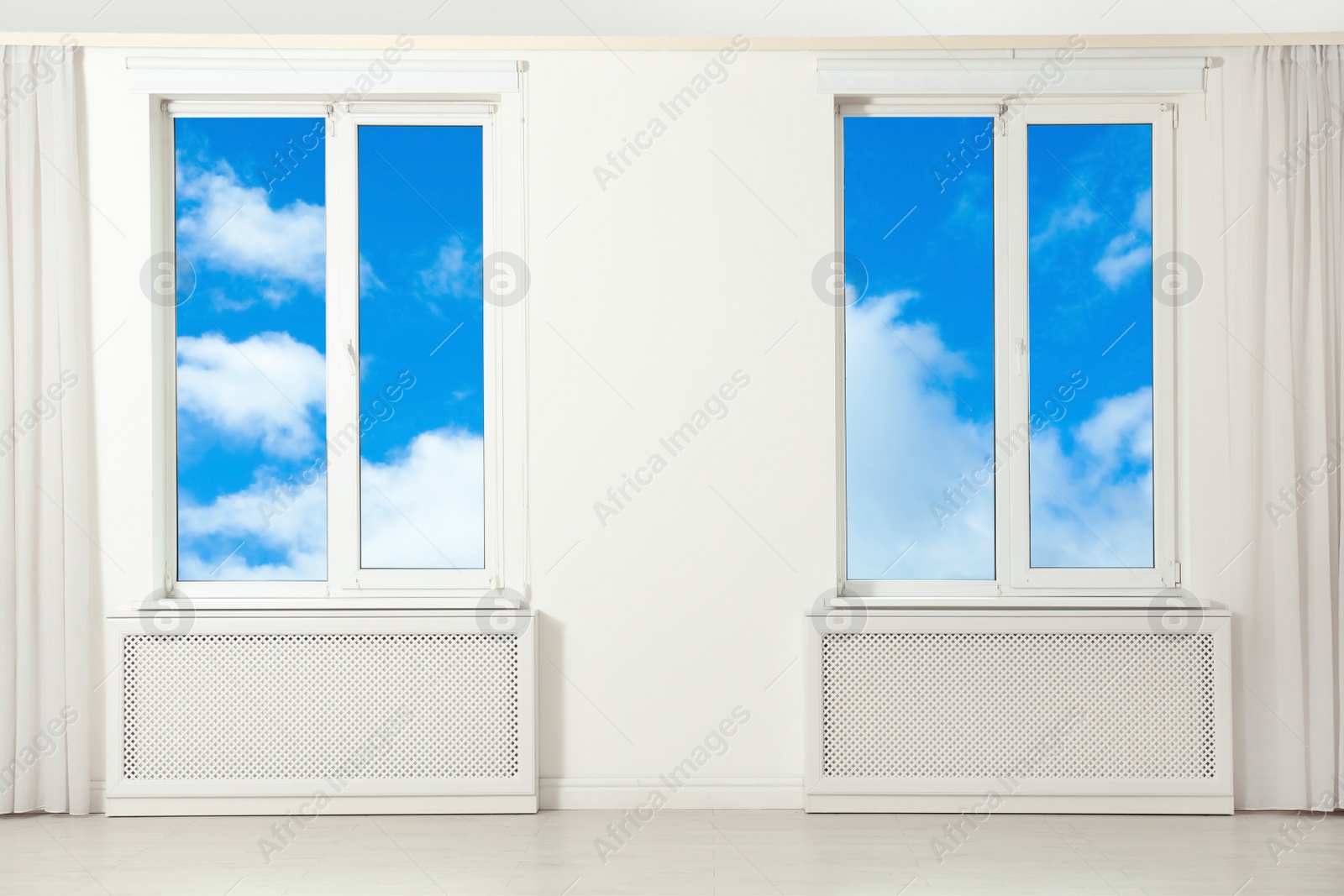 Image of Beautiful view on blue sky with clouds through windows in room