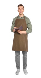 Handsome waiter in apron taking order on white background