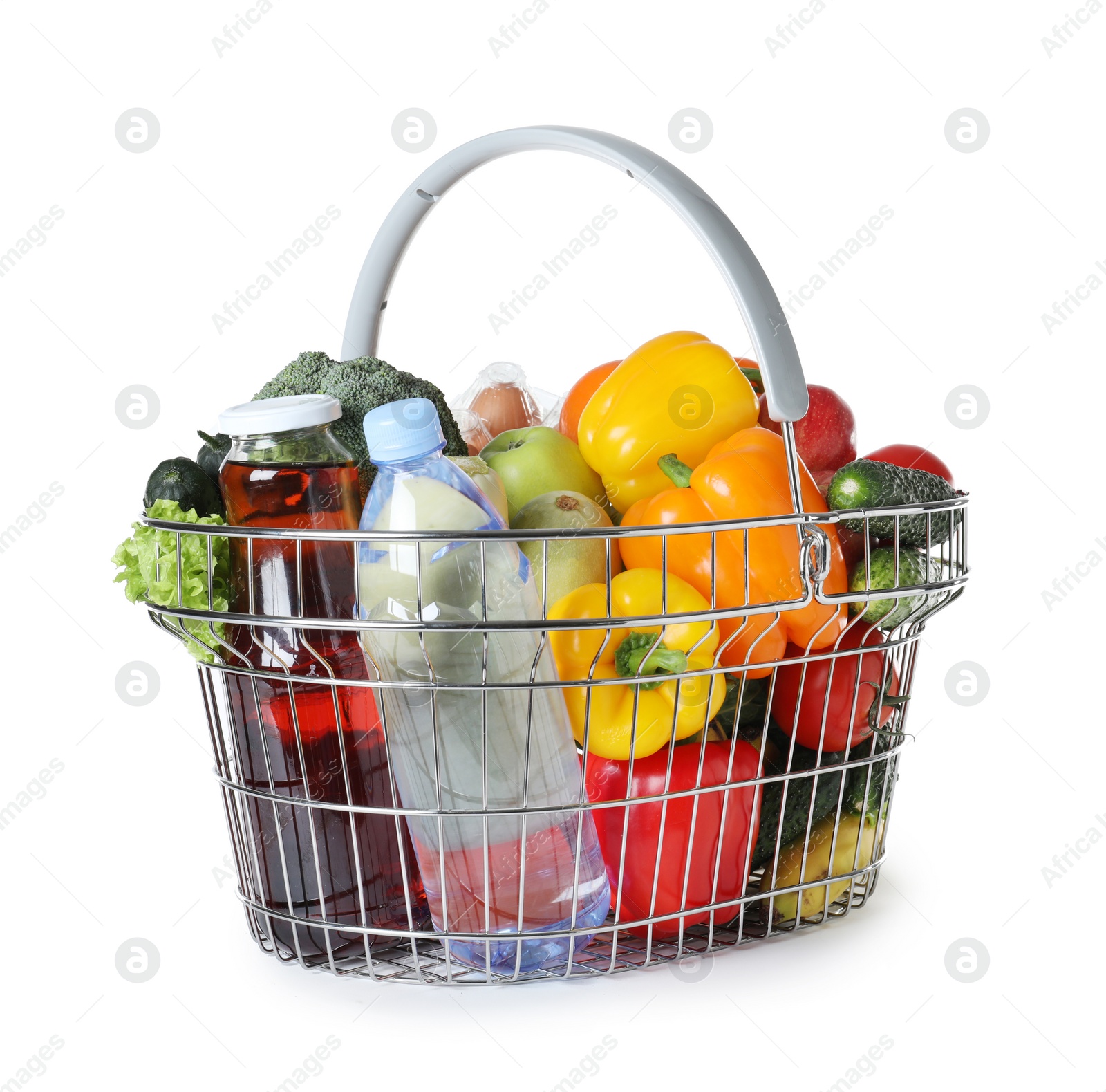 Photo of Shopping basket with grocery products on white background