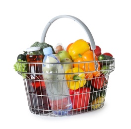 Photo of Shopping basket with grocery products on white background