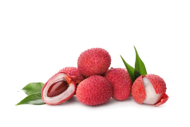 Photo of Pile of fresh ripe lychees with green leaves on white background