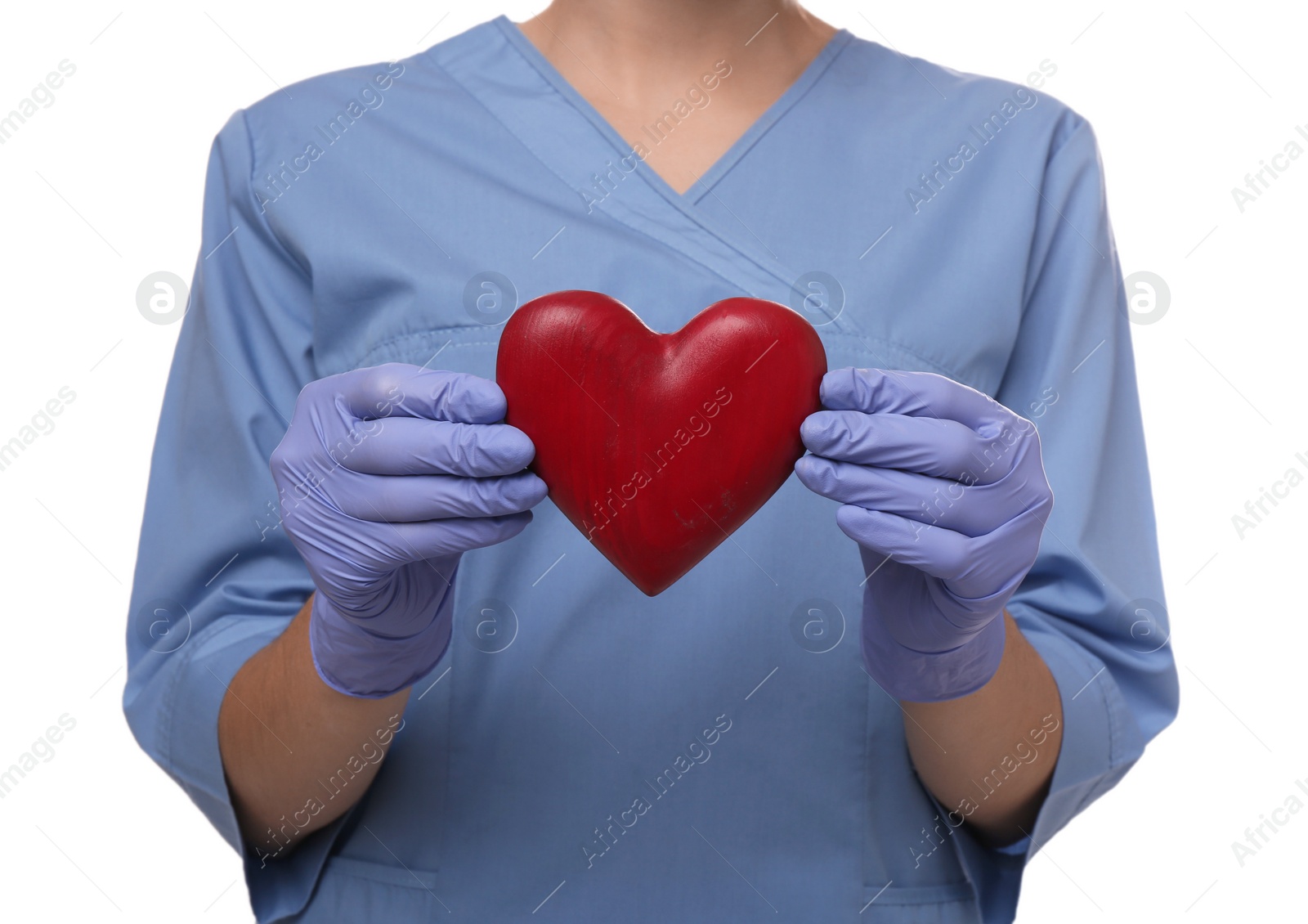 Photo of Doctor holding red heart on white background, closeup. Cardiology concept