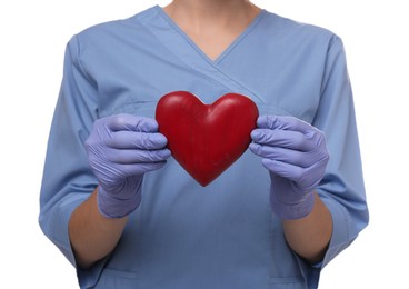 Photo of Doctor holding red heart on white background, closeup. Cardiology concept