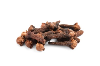 Pile of aromatic dry cloves on white background