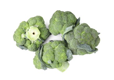 Photo of Pile of fresh raw green broccoli isolated on white, top view