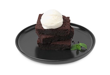 Photo of Tasty brownies with ice cream and mint isolated on white