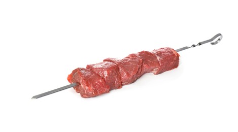 Metal skewer with raw meat on white background