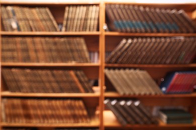 Photo of Blurred view of books on shelves in library