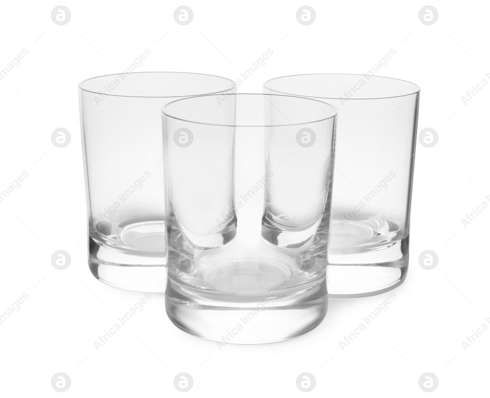 Photo of Elegant clean empty shot glasses isolated on white