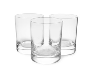 Photo of Elegant clean empty shot glasses isolated on white