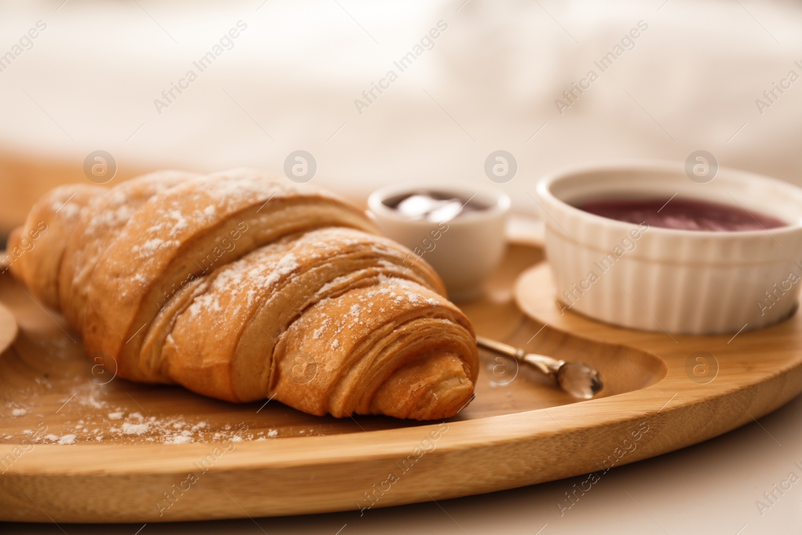 Photo of Delicious croissant and jam on table. Delicious morning meal