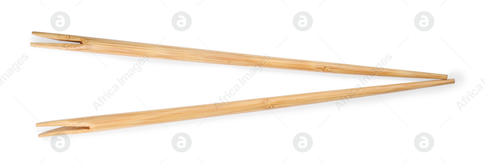 Photo of Pair of wooden chopsticks isolated on white, top view