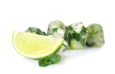 Photo of Lime and mint ice cubes with slice of fresh fruit on white background