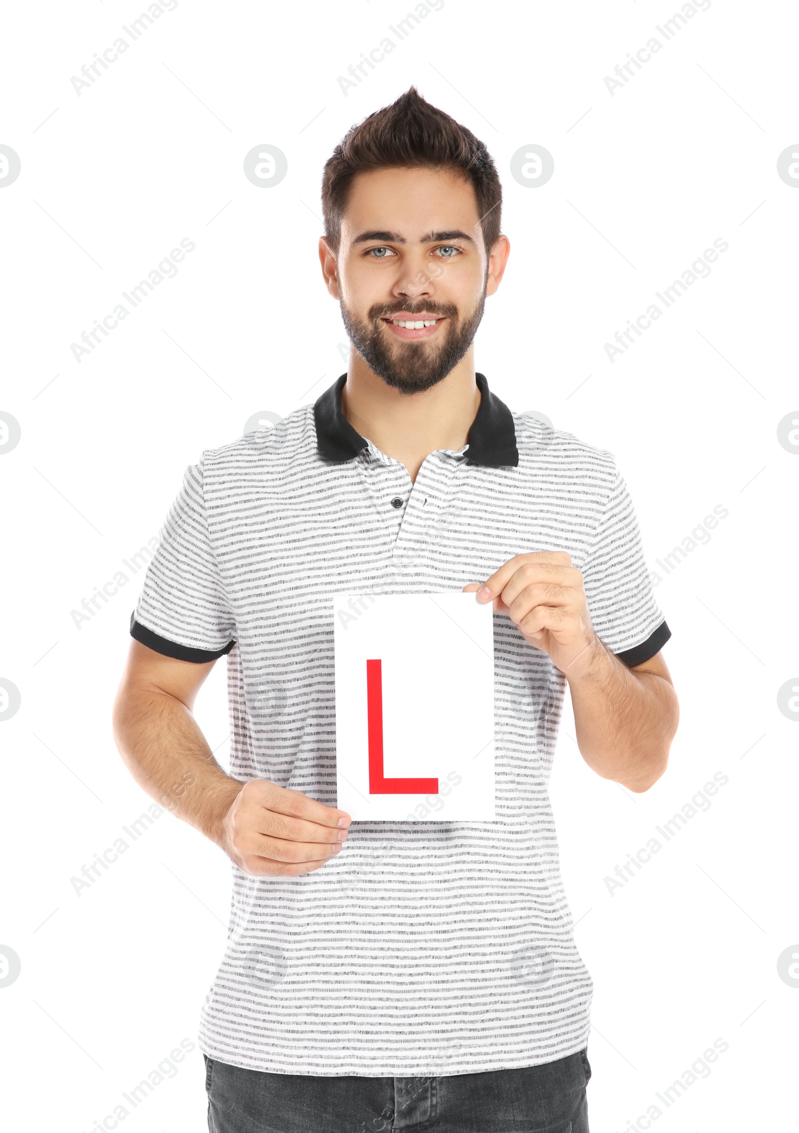 Photo of Young man with L-plate on white background. Getting driving license