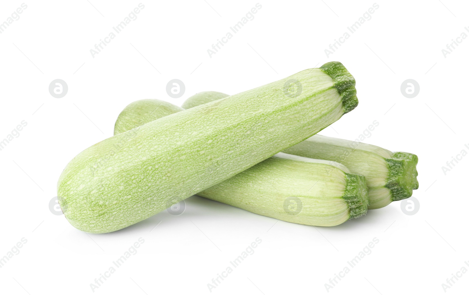 Photo of Raw green ripe zucchinis isolated on white