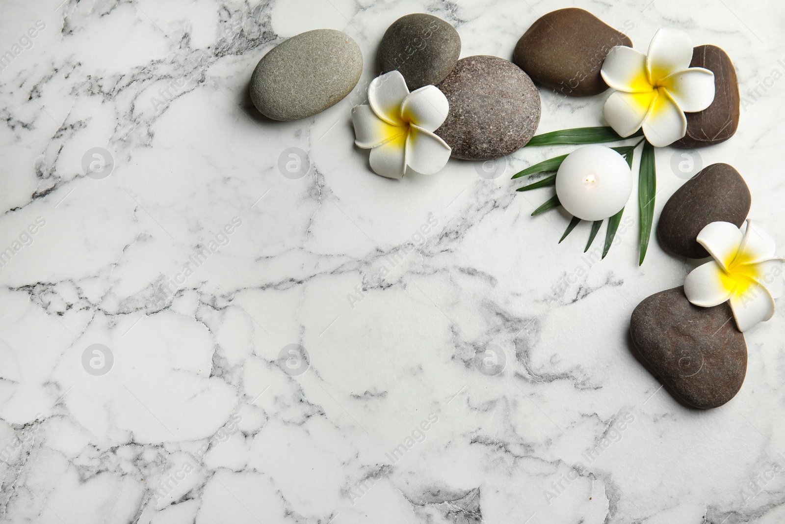 Photo of Flat lay composition with stones on white marble background, space for text. Zen concept