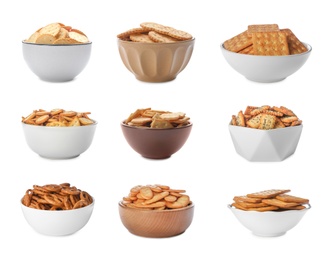 Set of different tasty crackers in bowls on white background