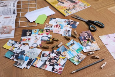 Photo of Composition with different photos, magazines and metal grid on wooden background. Creating vision board
