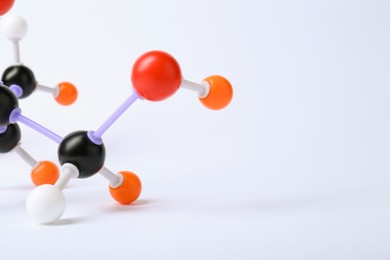 Photo of Molecule of sugar on white background, closeup. Chemical model