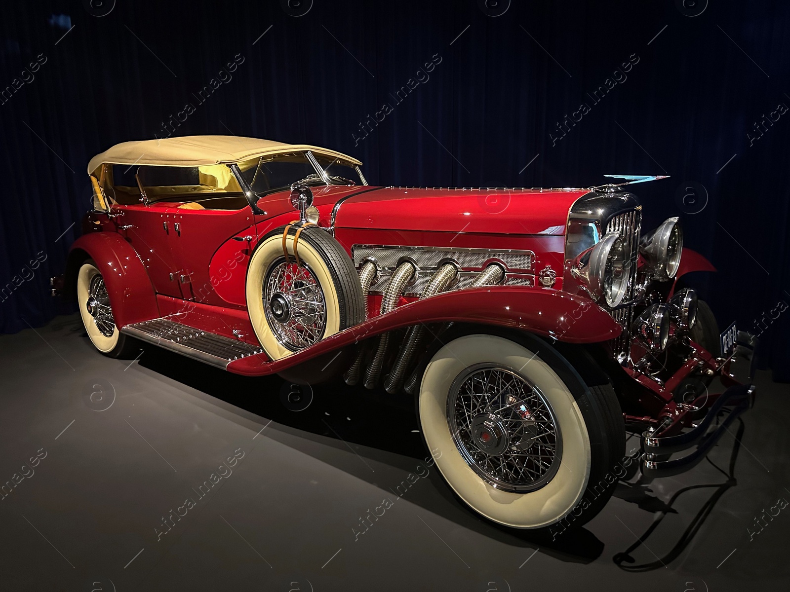 Photo of Hague, Netherlands - November 8, 2022: Beautiful view of red retro car in Louwman museum