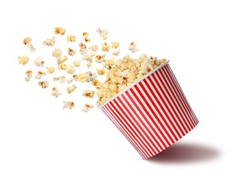 Image of Popcorn flying into bucket on white background