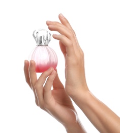 Photo of Young woman with perfume bottle on white background, closeup