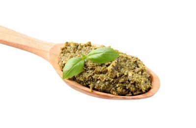 Photo of Wooden spoon with delicious pesto sauce and basil isolated on white