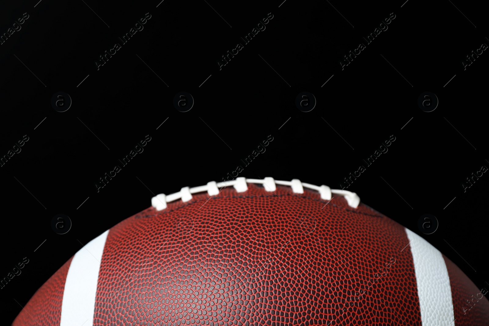 Photo of New leather American football on chalkboard, closeup