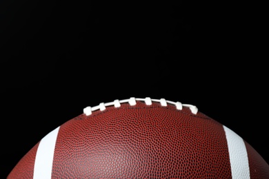 New leather American football on chalkboard, closeup