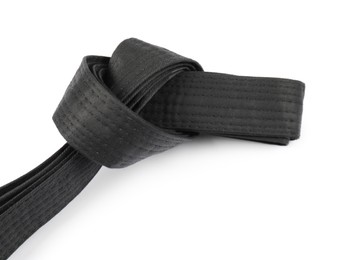 Photo of Black karate belt isolated on white. Martial arts uniform